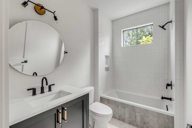 full bathroom with toilet, vanity, and tiled shower / bath combo