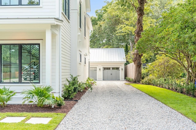 view of side of home with a garage