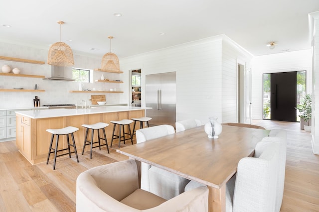 dining area featuring light wood-type flooring