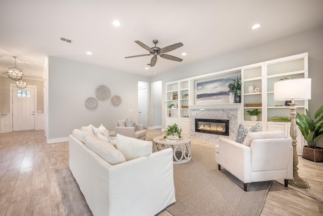 331 Fish Creek Ct, Summerville, SC 29486 - living room with a fireplace, light wood finished floors, a ceiling fan, recessed lighting, and baseboards