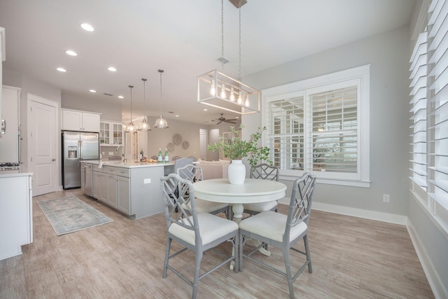 331 Fish Creek Ct, Summerville, SC 29486 - dining area with light wood-type flooring, recessed lighting, ceiling fan, baseboards, and a chandelier