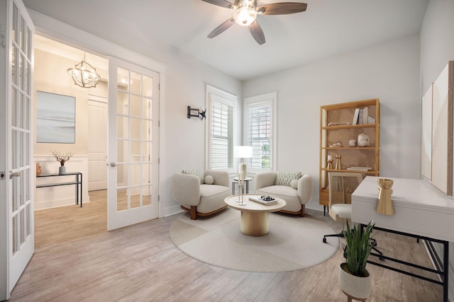 331 Fish Creek Ct, Summerville, SC 29486 - living area with french doors, wood finished floors, a ceiling fan, a chandelier, and baseboards