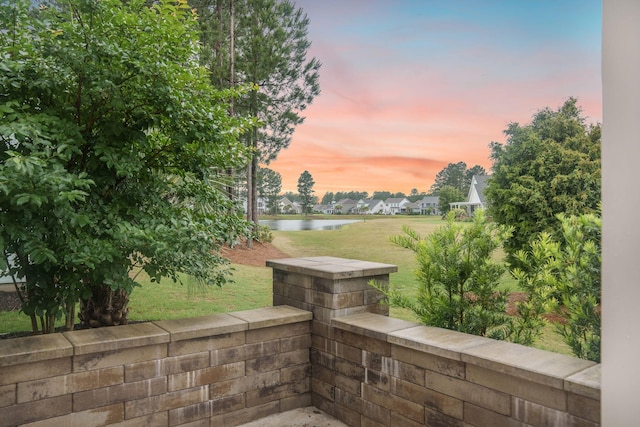 331 Fish Creek Ct, Summerville, SC 29486 - patio terrace at dusk featuring a water view