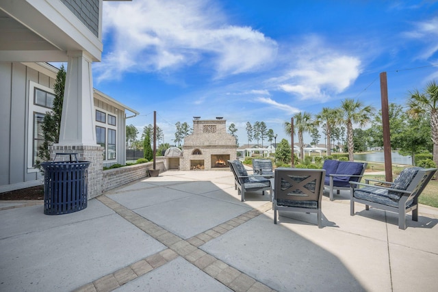 331 Fish Creek Ct, Summerville, SC 29486 - view of patio with an outdoor living space with a fireplace and a water view