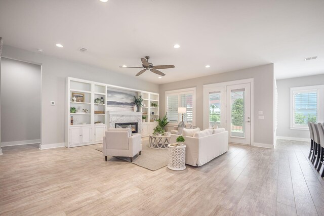 331 Fish Creek Ct, Summerville, SC 29486 - living room featuring a ceiling fan, light wood-style flooring, recessed lighting, baseboards, and a premium fireplace