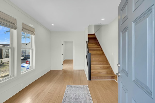 foyer featuring recessed lighting, stairway, and light wood finished floors