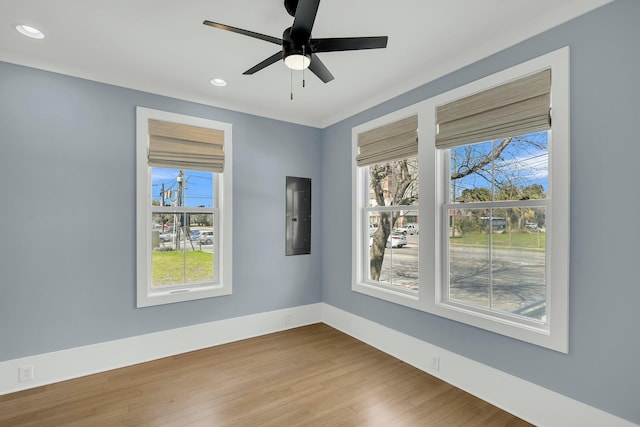 unfurnished room featuring wood finished floors, recessed lighting, and a healthy amount of sunlight