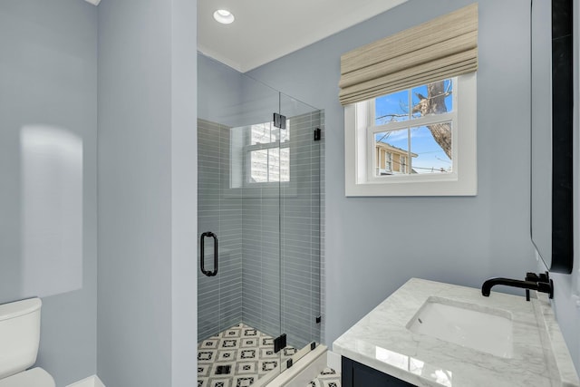 full bathroom with plenty of natural light, a shower stall, and toilet