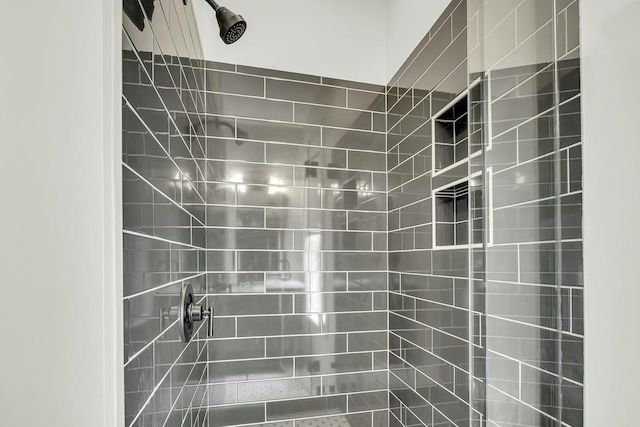 full bathroom with tiled shower