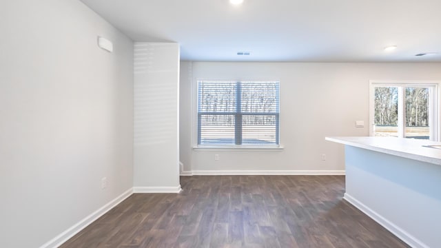 spare room featuring dark hardwood / wood-style floors