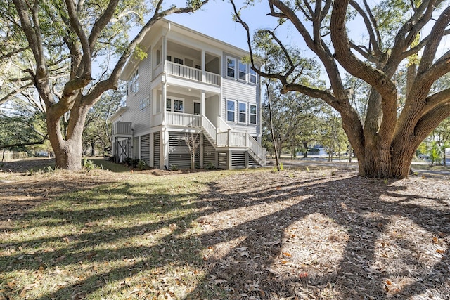 back of house featuring a balcony