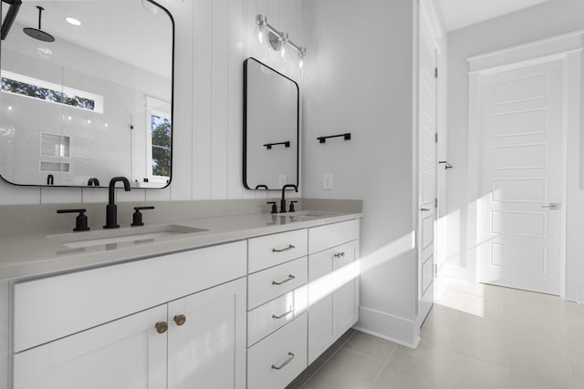 bathroom with vanity, tile patterned flooring, and a shower