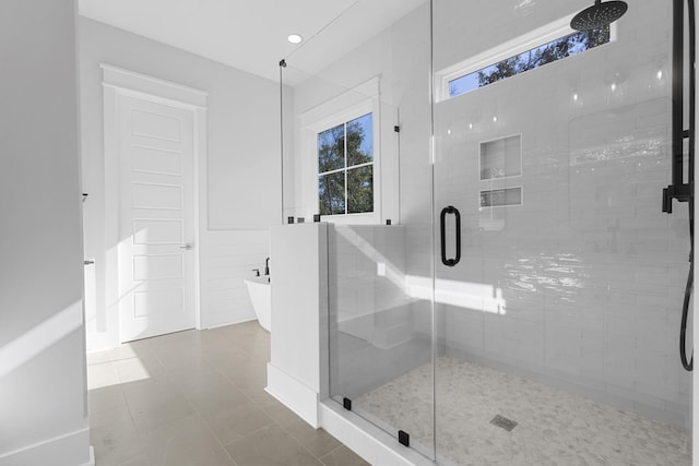 bathroom featuring separate shower and tub and tile patterned flooring