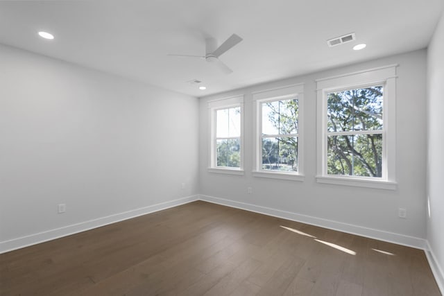 unfurnished room featuring ceiling fan and dark hardwood / wood-style floors