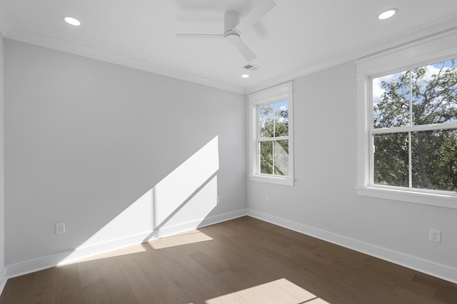 spare room featuring crown molding, dark hardwood / wood-style floors, and ceiling fan