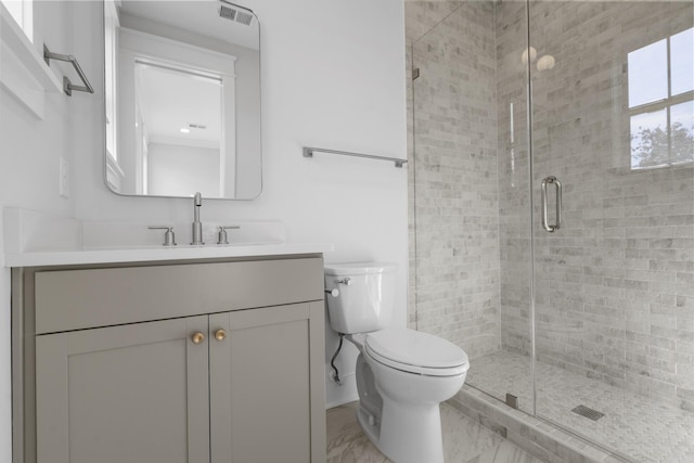 bathroom featuring vanity, toilet, and walk in shower