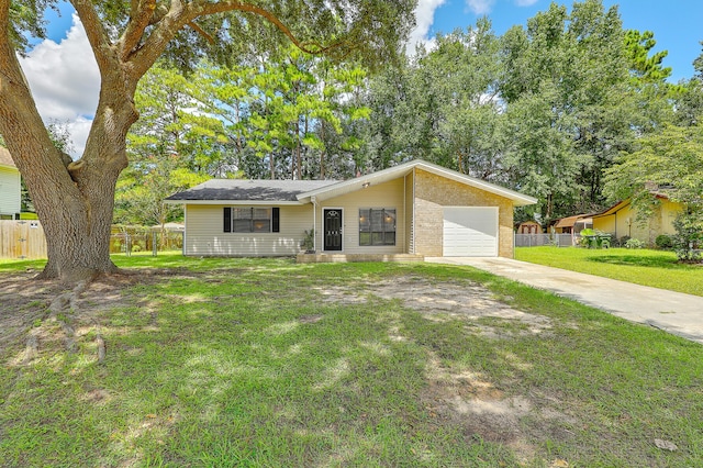 single story home with a garage and a front lawn