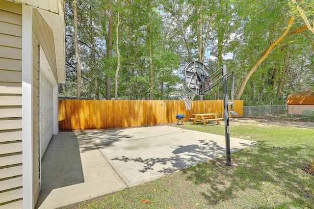 view of patio with basketball hoop