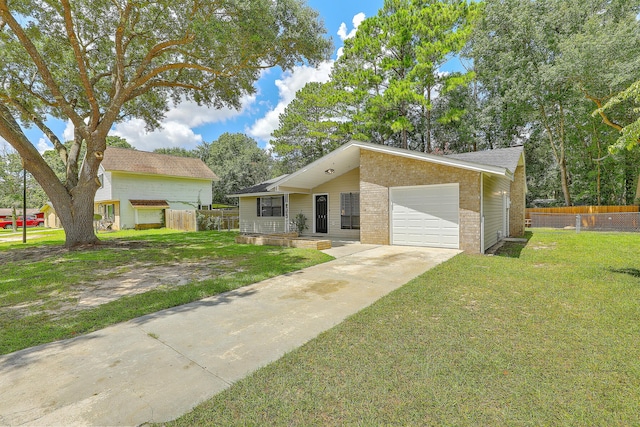 view of front of property featuring a garage and a front yard