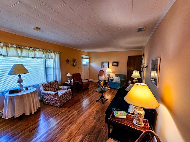 living room with wood-type flooring and crown molding