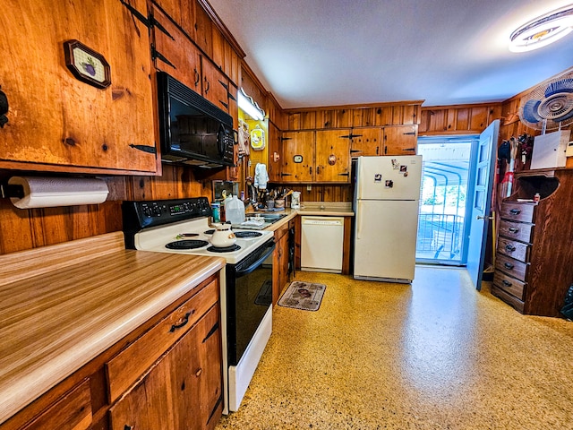 kitchen featuring sink and white appliances