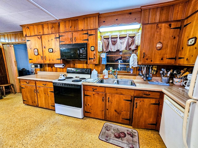 kitchen featuring sink and white appliances