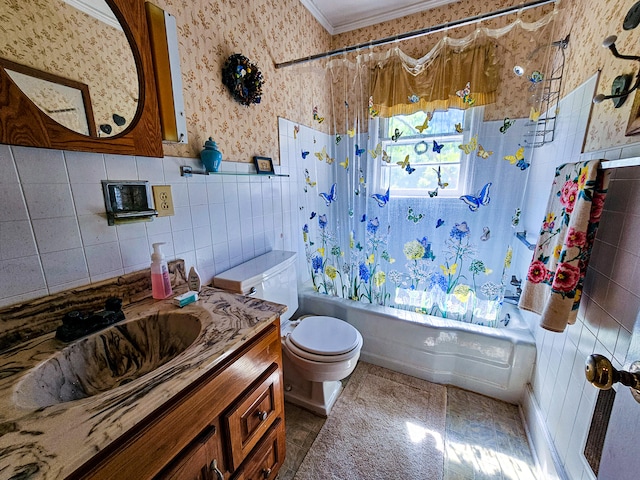 full bathroom with tile patterned floors, vanity, tile walls, and toilet