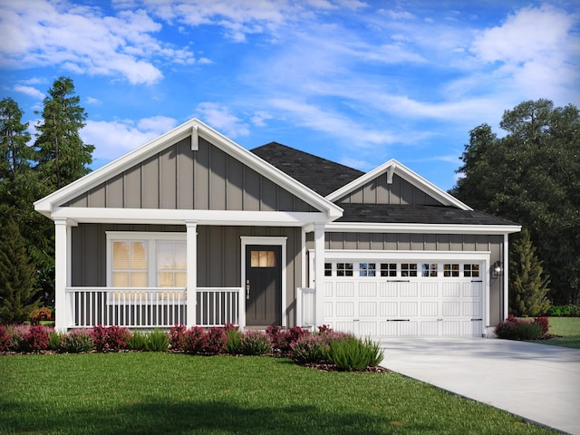 view of front of house featuring a porch, a garage, and a front lawn