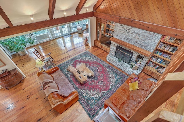 2287 Shoreline Dr, Johns Island, SC 29455 - living room featuring hardwood / wood-style flooring, a glass covered fireplace, and beam ceiling