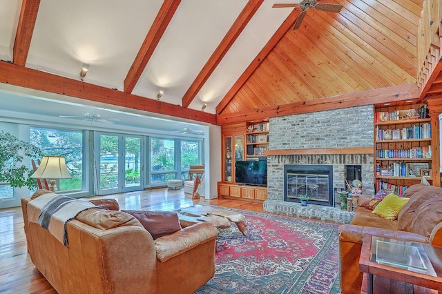 2287 Shoreline Dr, Johns Island, SC 29455 - living room with ceiling fan, healthy amount of natural light, wood finished floors, and a fireplace