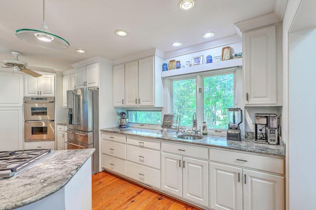 2287 Shoreline Dr, Johns Island, SC 29455 - kitchen featuring stainless steel appliances, ceiling fan, white cabinetry, light wood-style floors, and recessed lighting
