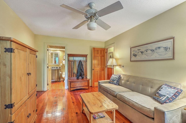 2287 Shoreline Dr, Johns Island, SC 29455 - living room with light wood finished floors, ceiling fan, and a textured ceiling
