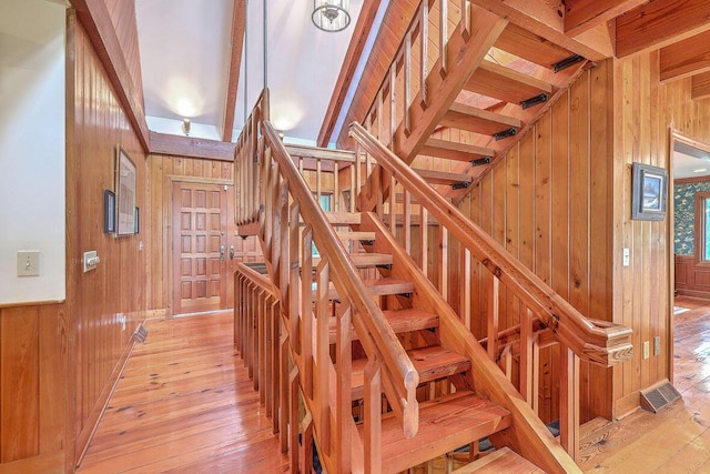 2287 Shoreline Dr, Johns Island, SC 29455 - staircase featuring wood walls and hardwood / wood-style flooring