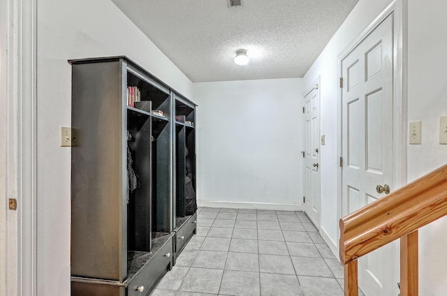 2287 Shoreline Dr, Johns Island, SC 29455 - mudroom with a textured ceiling and light tile patterned floors