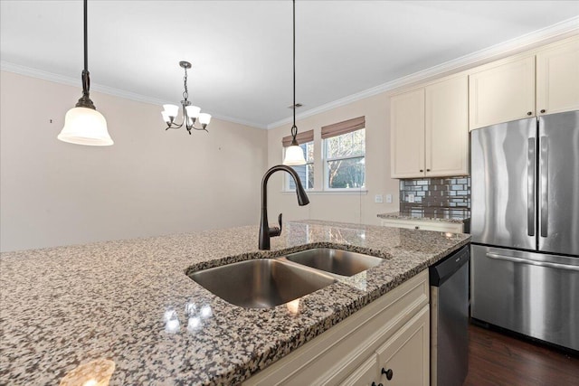 kitchen featuring stainless steel appliances, sink, crown molding, light stone counters, and tasteful backsplash