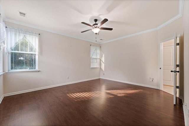 spare room with crown molding and dark hardwood / wood-style flooring