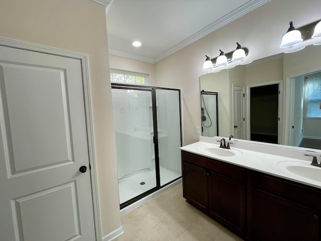 bathroom featuring vanity, tile patterned flooring, ornamental molding, and an enclosed shower