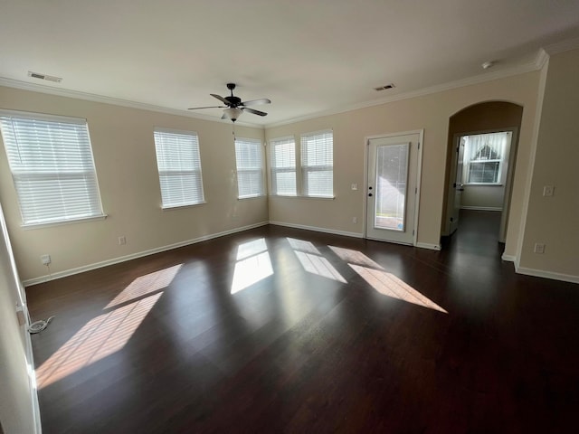 interior space with ornamental molding, dark hardwood / wood-style floors, and ceiling fan