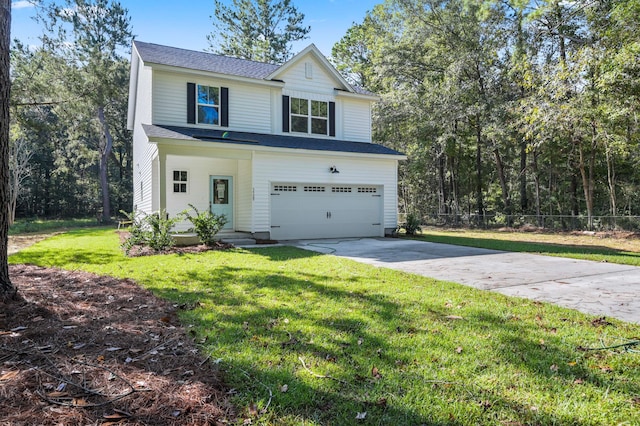 view of front of home featuring a garage and a front lawn