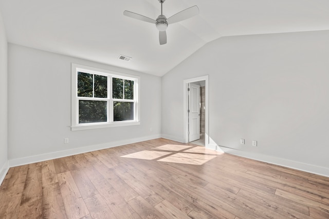 unfurnished room with ceiling fan, light hardwood / wood-style flooring, and lofted ceiling