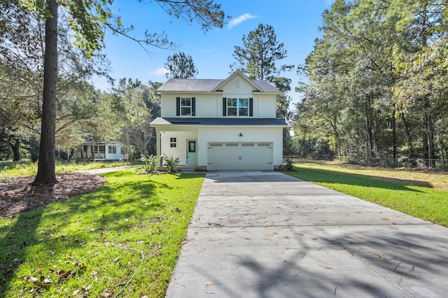 view of front of property featuring a front yard and a garage