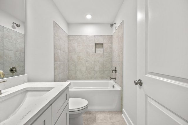 full bathroom featuring tiled shower / bath combo, tile patterned flooring, vanity, and toilet