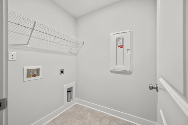 laundry area featuring washer hookup, hookup for an electric dryer, electric panel, and light tile patterned floors