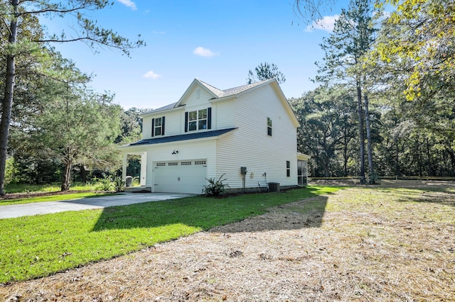 view of side of property featuring a garage and a yard