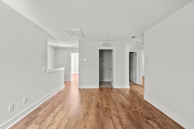 unfurnished room with light wood-type flooring