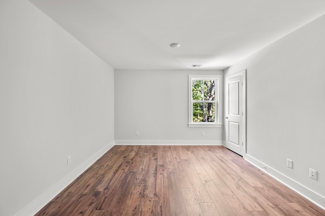 empty room featuring hardwood / wood-style flooring