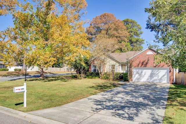 view of front of house with a garage and a front yard