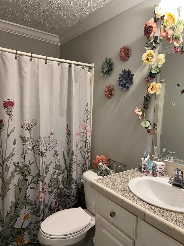 bathroom featuring a textured ceiling, a shower with shower curtain, toilet, vanity, and ornamental molding