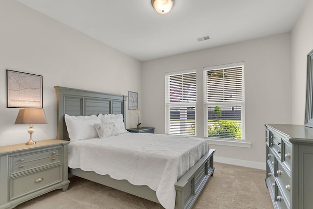 bedroom with light colored carpet