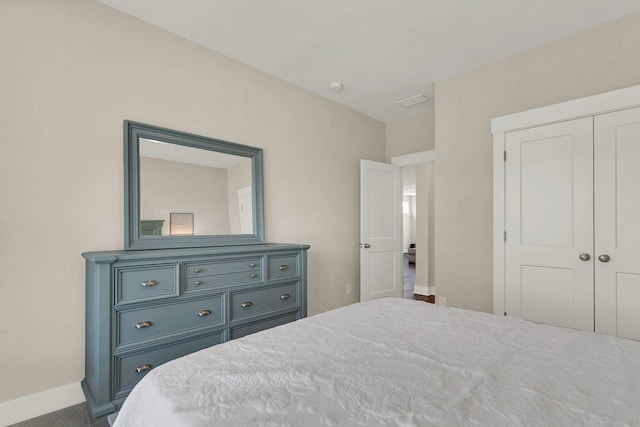 bedroom featuring a closet and carpet